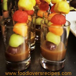 fruit skewers with caramel or chocolate sauce